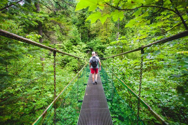 What factors should you consider when adjusting the suspension for better load handling?